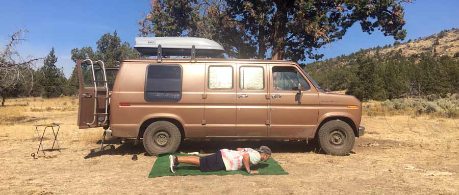 Sober man exercises while traveling in his van