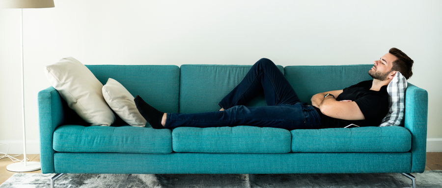 man resting on a couch