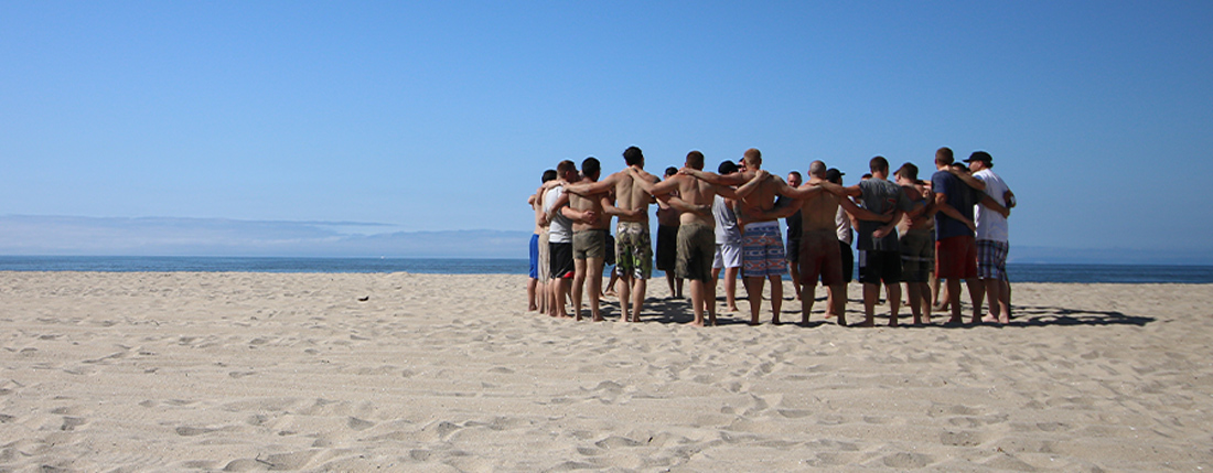 team huddle on the beach