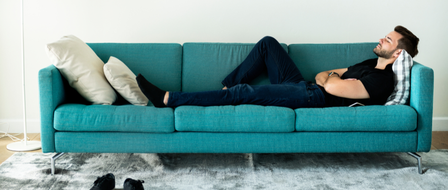 man resting on a couch