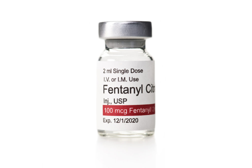 image of Fentanyl Citrate anesthetic solution vial isolated on white.
